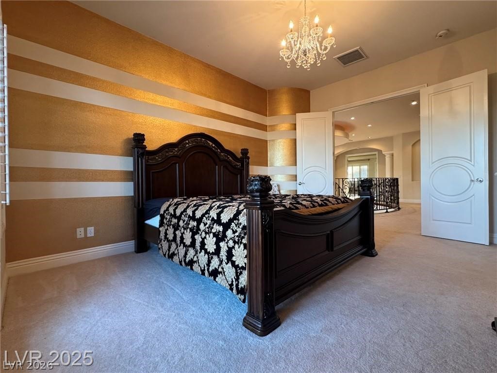 861 Majestic Ridge Court Henderson, NV 89052 - Photo 58 of 68 Bedroom featuring carpet and suspended lighting