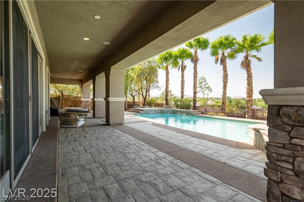 861 Majestic Ridge Court Henderson, NV 89052 - Photo 62 of 68 View of pool with patio surround and a fenced backyard