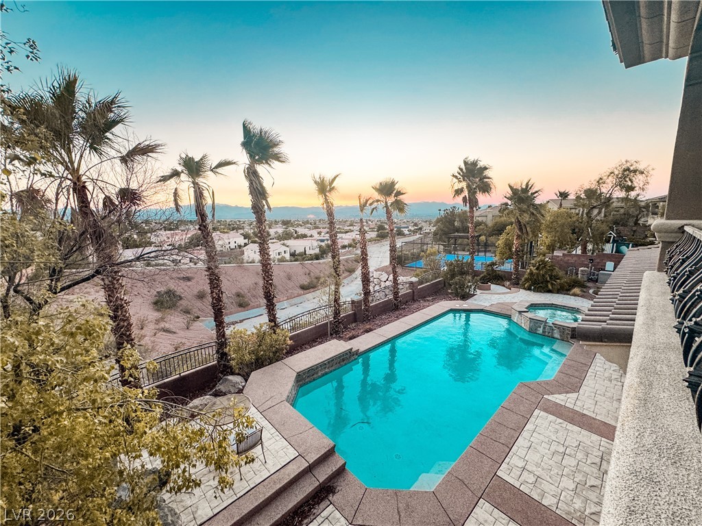 861 Majestic Ridge Court Henderson, NV 89052 - Photo 68 of 68 Integrated pool / spa featuring a patio and a fenced backyard
