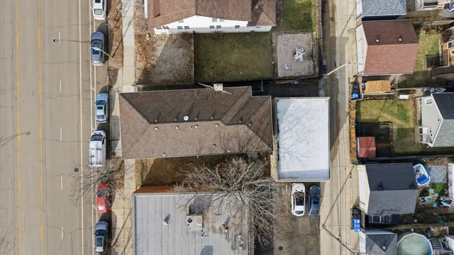an aerial view of residential houses with outdoor space