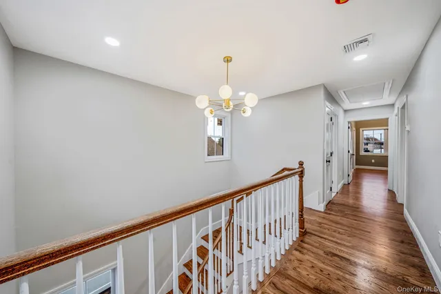 a view of a hallway with a chandelier