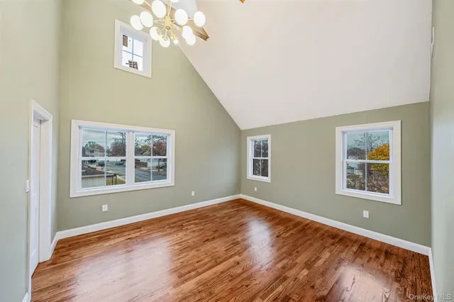 a view of room with wooden floor and window