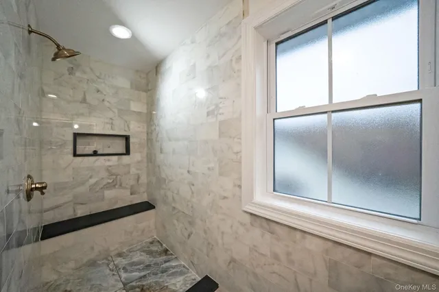 a bathroom with a double vanity sink mirror and