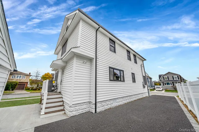 a view of a house with a street