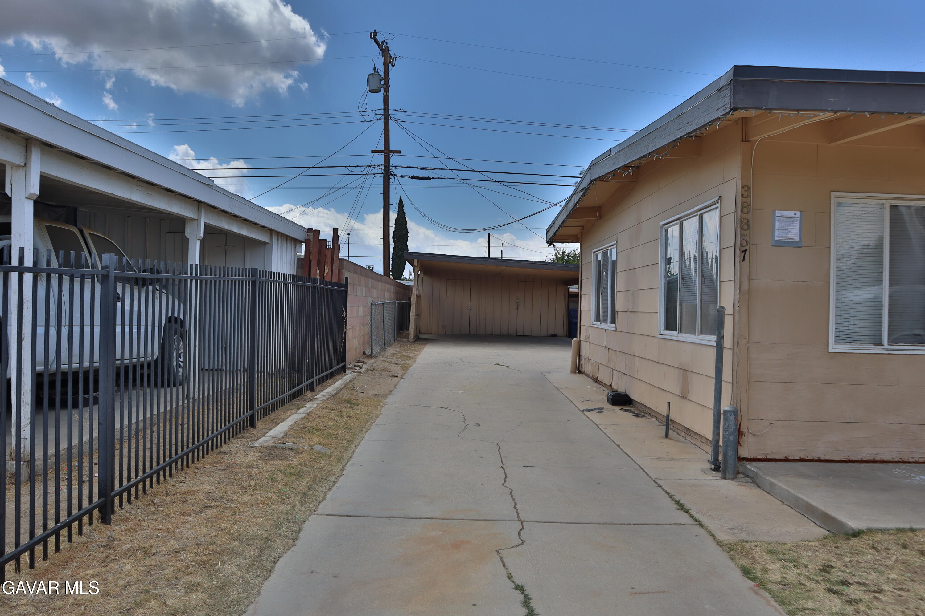 38857 Rambler Avenue Palmdale, CA 93550 - Photo 5 of 8 a view of a house with a wooden deck