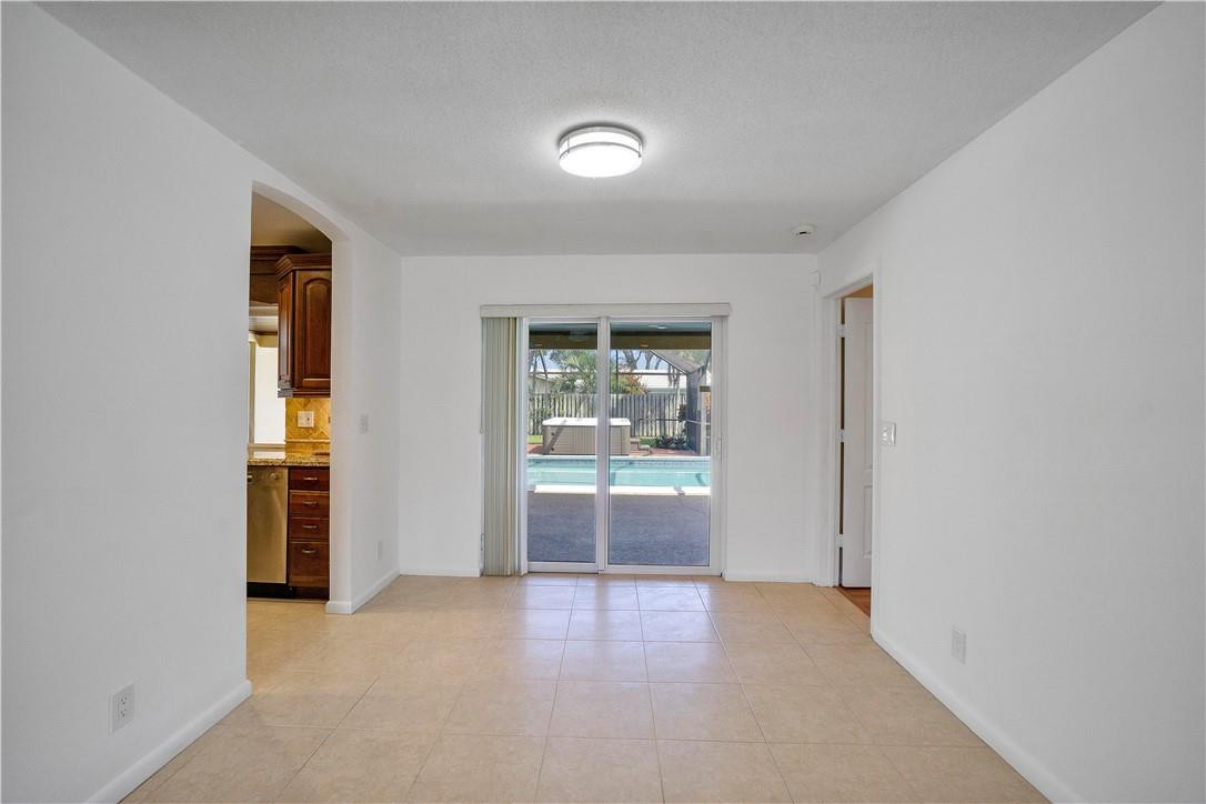 1423 Southwest 14th Street Boca Raton, FL 33486 - Photo 15 of 45 an empty room with glass door and door