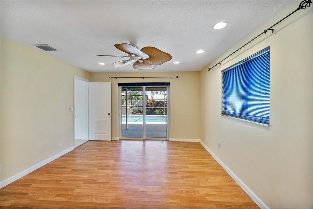 1423 Southwest 14th Street Boca Raton, FL 33486 - Photo 17 of 45 a view of an empty room with window and wooden floor