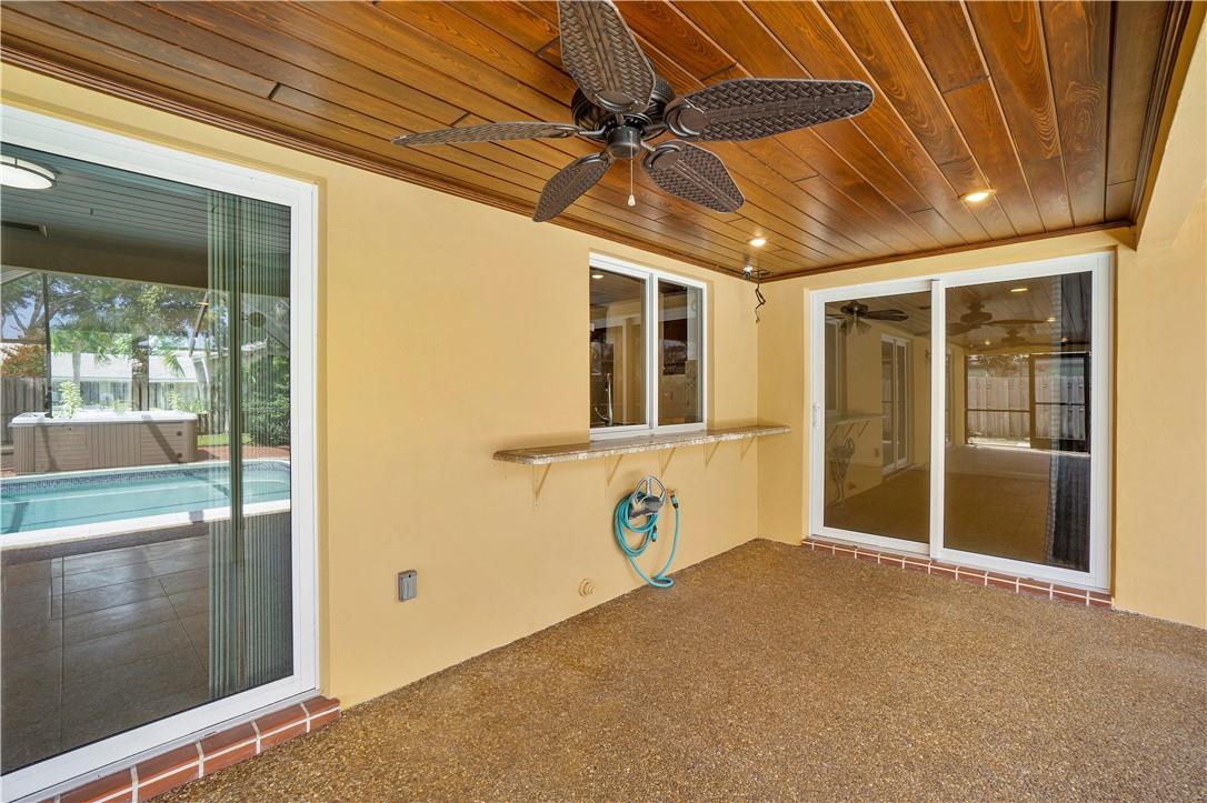 1423 Southwest 14th Street Boca Raton, FL 33486 - Photo 26 of 45 a front view of a house with a garage