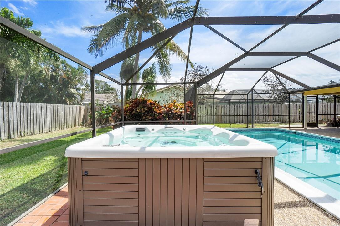 1423 Southwest 14th Street Boca Raton, FL 33486 - Photo 29 of 45 a view of a patio with a table and chairs