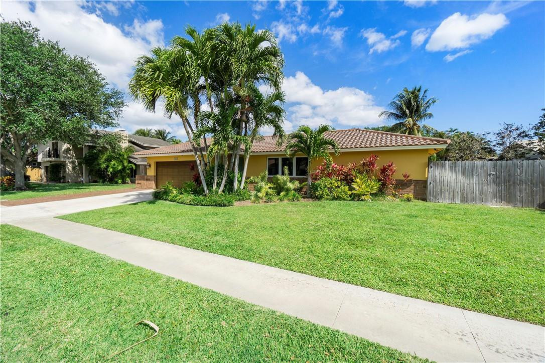 1423 Southwest 14th Street Boca Raton, FL 33486 - Photo 37 of 45 front view of a house with a yard