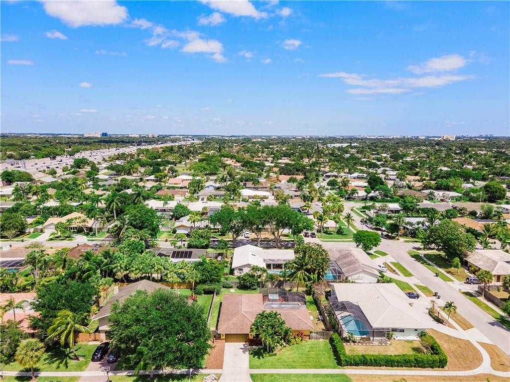1423 Southwest 14th Street Boca Raton, FL 33486 - Photo 40 of 45 an aerial view of residential houses with outdoor space and trees