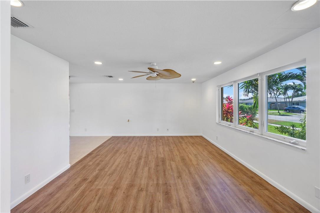 1423 Southwest 14th Street Boca Raton, FL 33486 - Photo 5 of 45 a view of empty room with wooden floor and fan