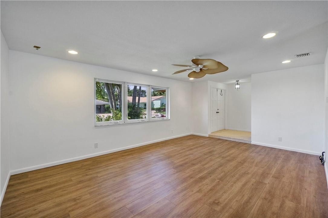 1423 Southwest 14th Street Boca Raton, FL 33486 - Photo 6 of 45 a view of empty room with wooden floor and fan