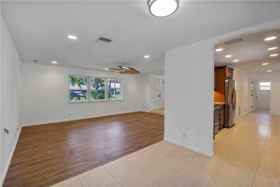 1423 Southwest 14th Street Boca Raton, FL 33486 - Photo 9 of 45 an empty room with wooden floor and windows