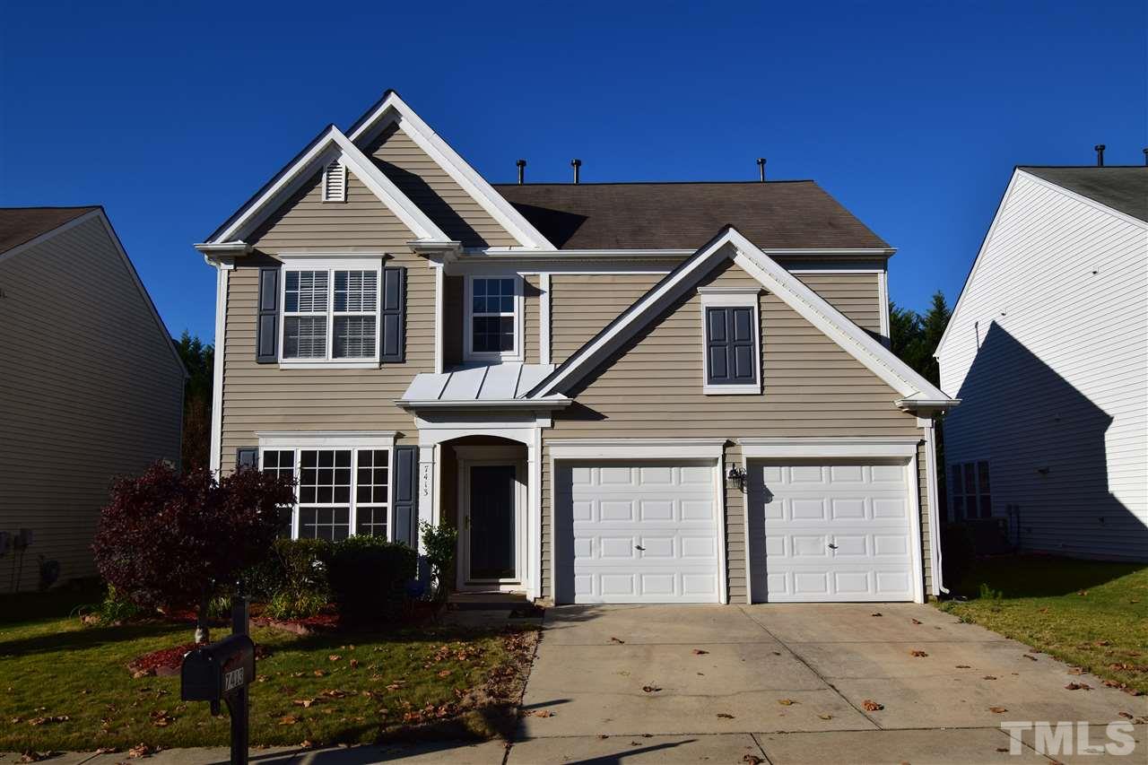 7413 Lagrange Drive Raleigh, NC 27613 - Photo 1 of 12 a front view of a house with a yard