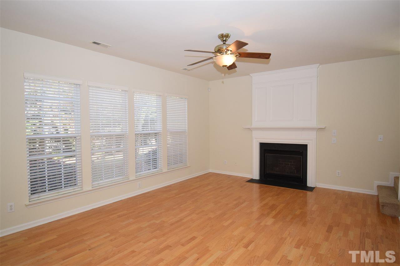 7413 Lagrange Drive Raleigh, NC 27613 - Photo 3 of 12 a view of an empty room with a fireplace and a window