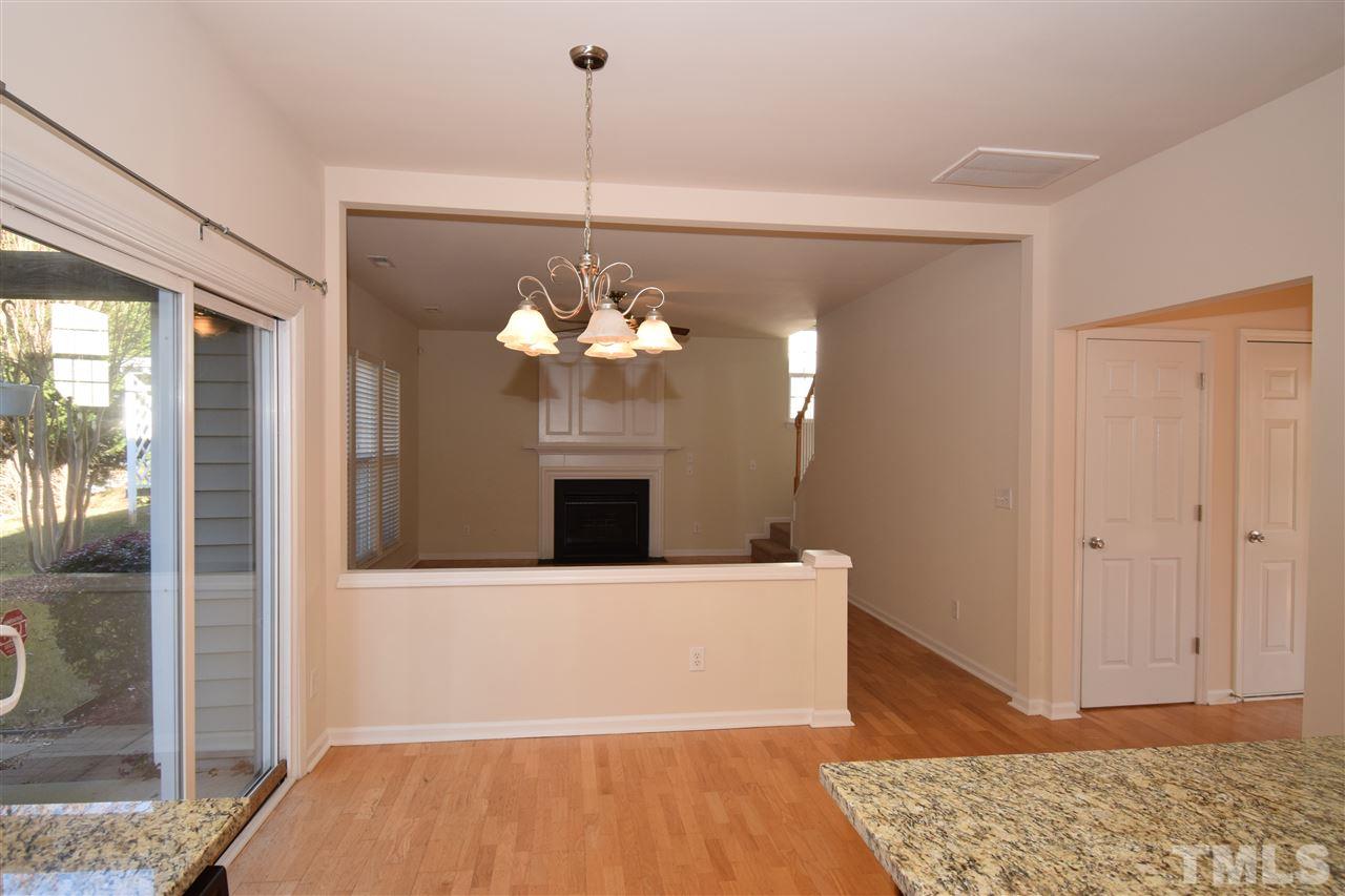 7413 Lagrange Drive Raleigh, NC 27613 - Photo 5 of 12 a view of a livingroom with a chandelier wooden floor and a chandelier