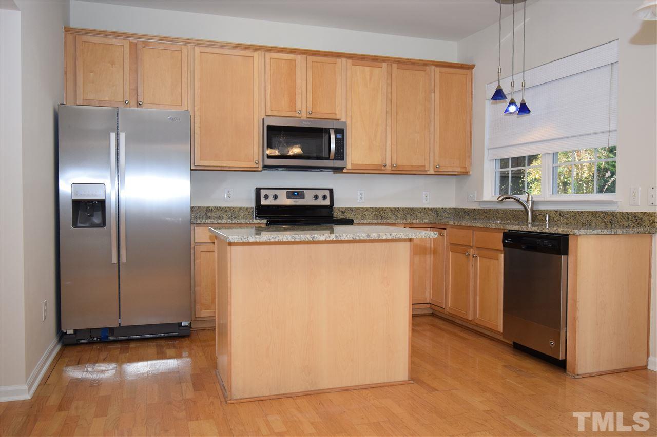 7413 Lagrange Drive Raleigh, NC 27613 - Photo 6 of 12 a kitchen with stainless steel appliances granite countertop a stove a sink and a microwave