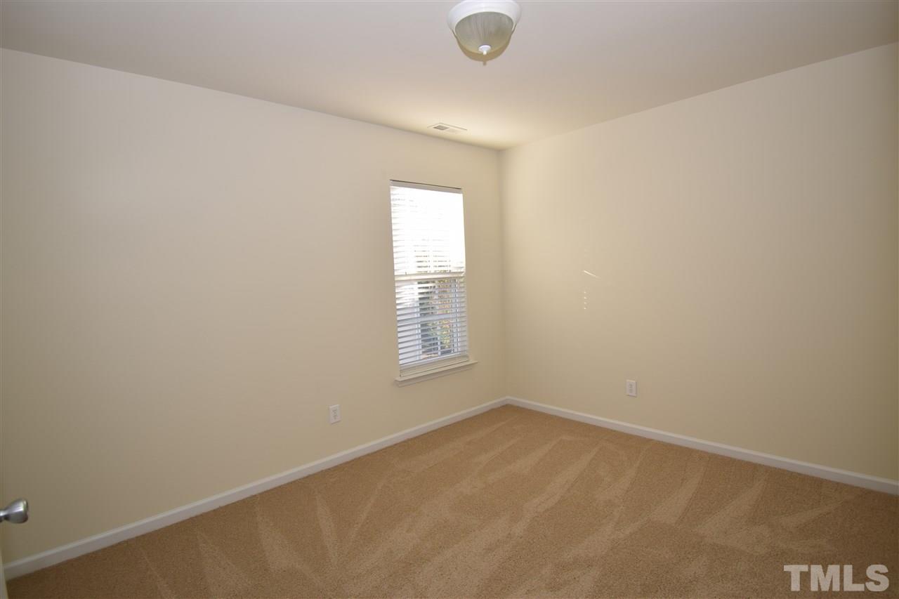 7413 Lagrange Drive Raleigh, NC 27613 - Photo 10 of 12 an empty room with a window