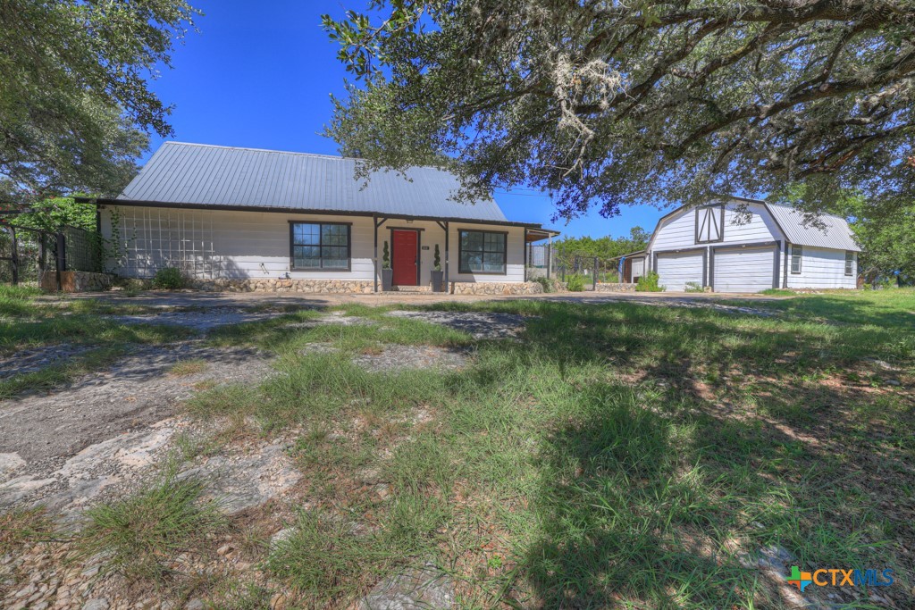 500 Line Camp Loop Spring Branch, TX 78070 - Photo 1 of 48 a front view of a house with a yard