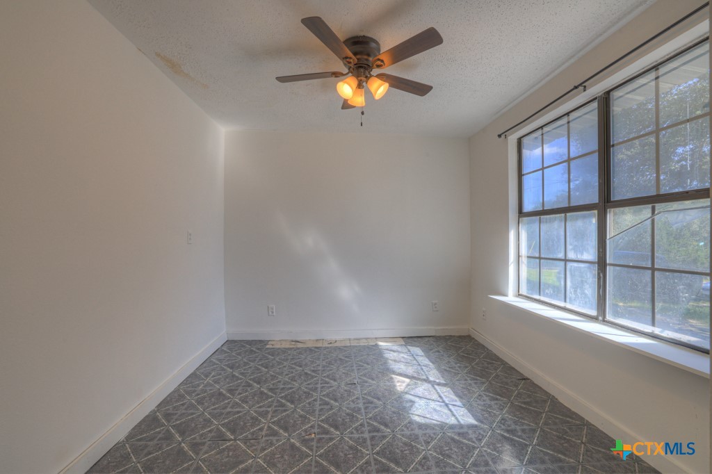 500 Line Camp Loop Spring Branch, TX 78070 - Photo 15 of 48 an empty room with ceiling fan and window