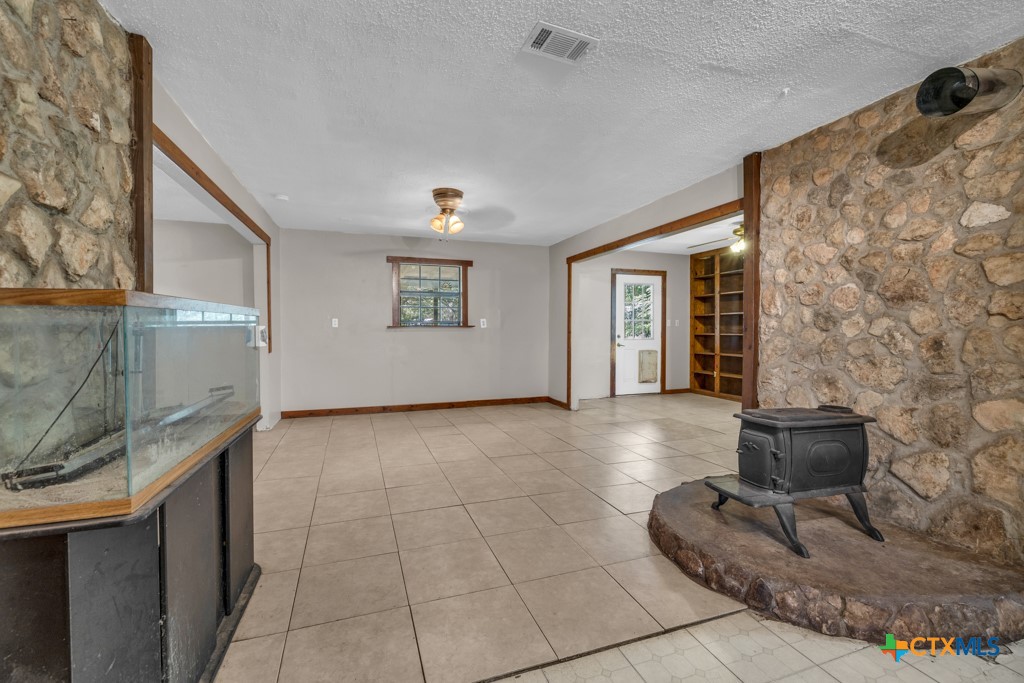500 Line Camp Loop Spring Branch, TX 78070 - Photo 20 of 48 a view of an empty room with a fireplace