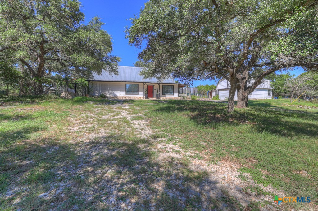 500 Line Camp Loop Spring Branch, TX 78070 - Photo 2 of 48 a view of a house with a yard