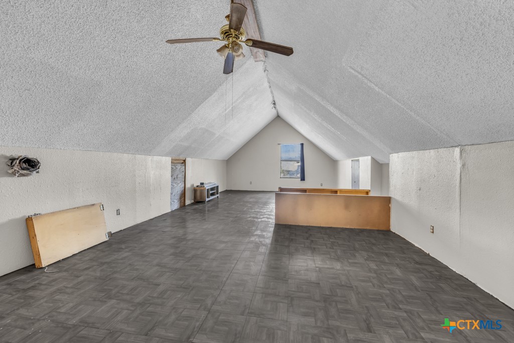 500 Line Camp Loop Spring Branch, TX 78070 - Photo 36 of 48 a view of a kitchen with furniture and a ceiling fan