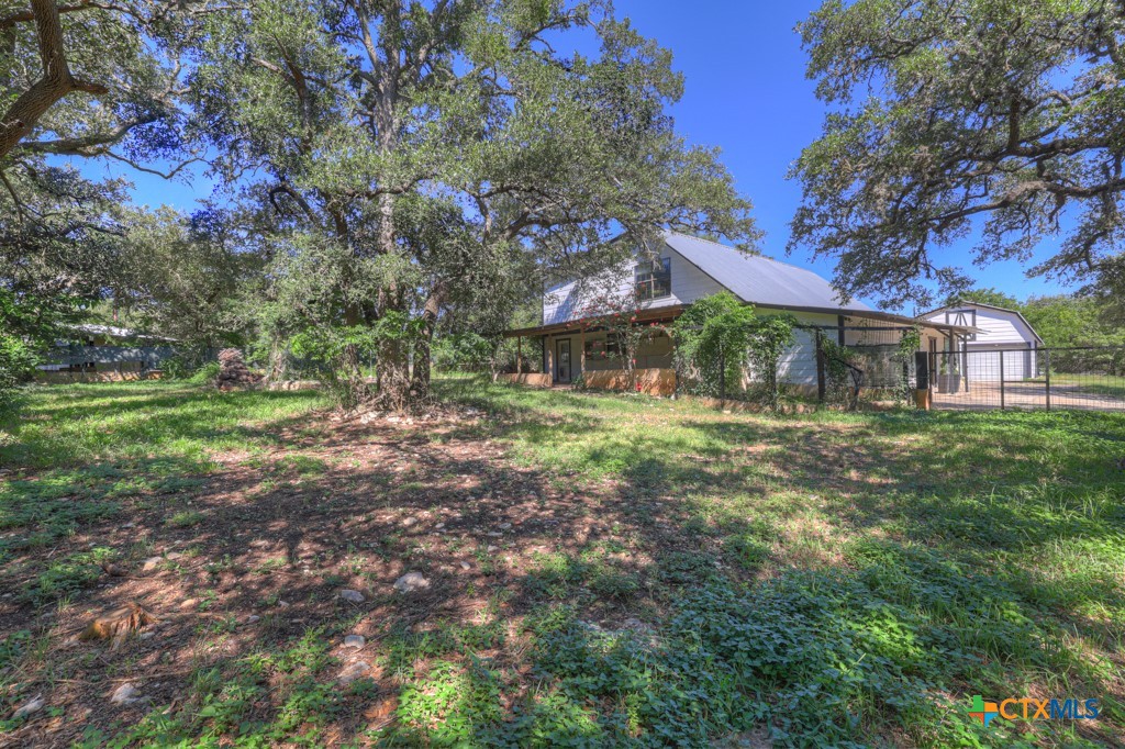 500 Line Camp Loop Spring Branch, TX 78070 - Photo 42 of 48 a front view of a house with a yard