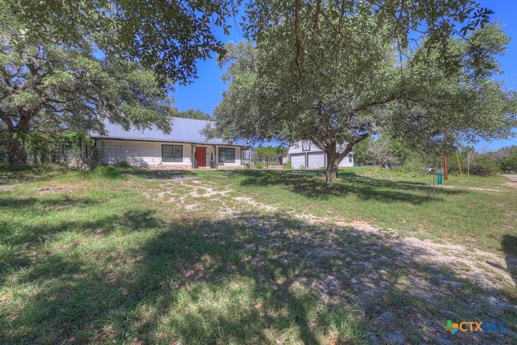 500 Line Camp Loop Spring Branch, TX 78070 - Photo 7 of 48 a view of a house with a big yard and large trees