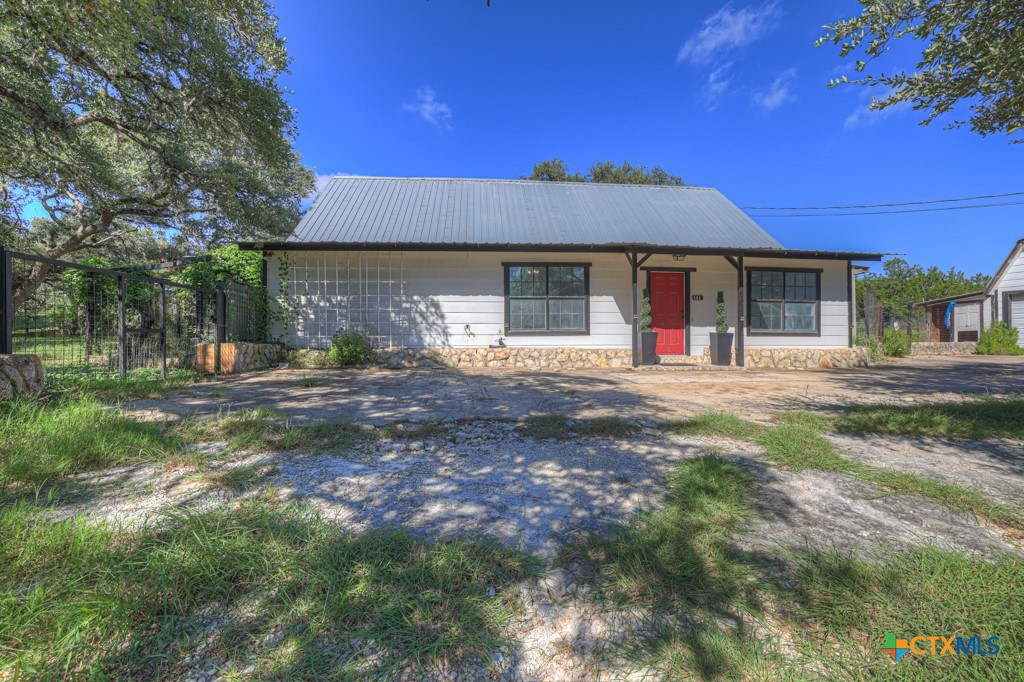 500 Line Camp Loop Spring Branch, TX 78070 - Photo 8 of 48 a front view of a house with a yard