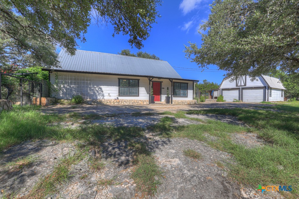 500 Line Camp Loop Spring Branch, TX 78070 - Photo 9 of 48 a house view with a sitting space and garden