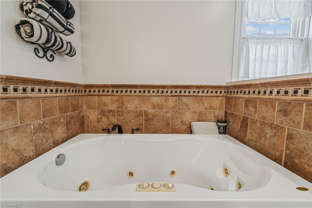 1625 Grooms Road Reidsville, NC 27320 - Photo 26 of 50 Jetted tub for relaxation in primary en suite.