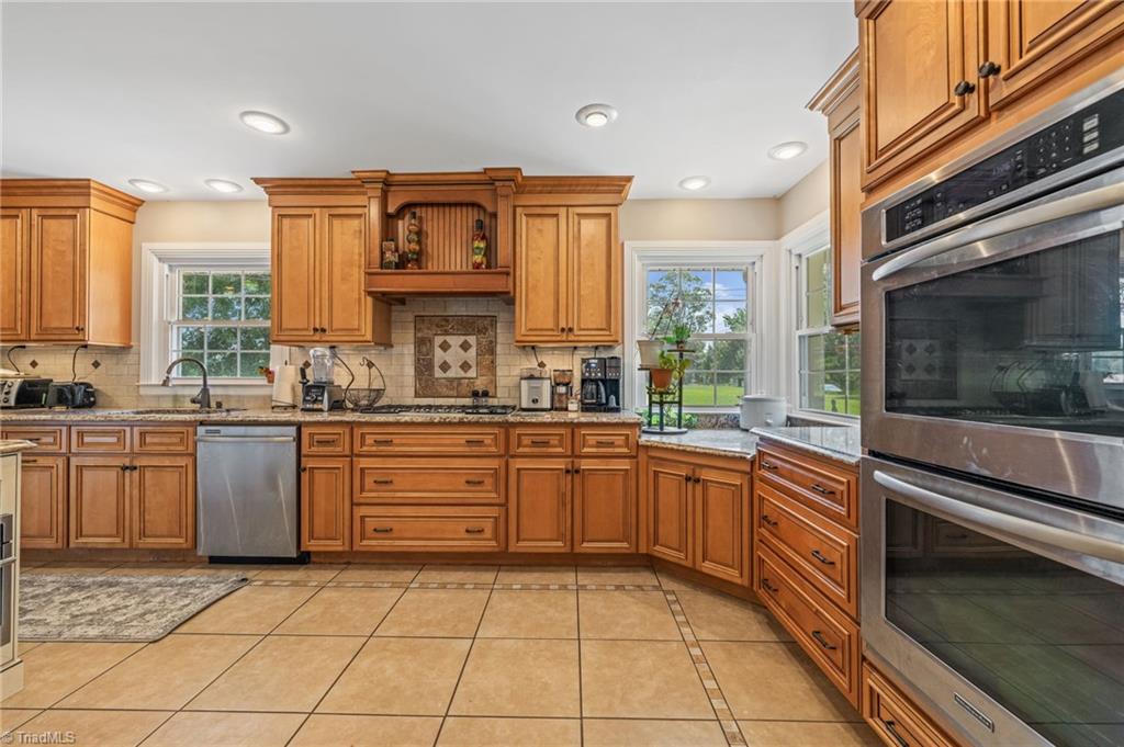 1625 Grooms Road Reidsville, NC 27320 - Photo 5 of 50 Updated, modern kitchen with granite countertops and luxury cabinets.