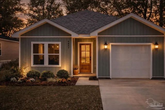 a front view of a house with garden