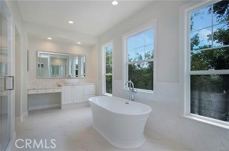 35 Winslow Street Ladera Ranch, CA 92694 - Photo 14 of 17 a bathroom with a bathtub and a sink