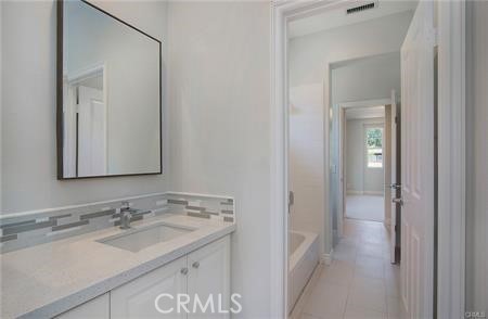 35 Winslow Street Ladera Ranch, CA 92694 - Photo 16 of 17 a bathroom with a sink and a mirror