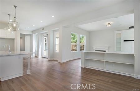 35 Winslow Street Ladera Ranch, CA 92694 - Photo 3 of 17 a view of an empty room with wooden floor and windows