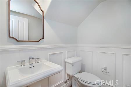 35 Winslow Street Ladera Ranch, CA 92694 - Photo 5 of 17 a bathroom with a sink a toilet and mirror