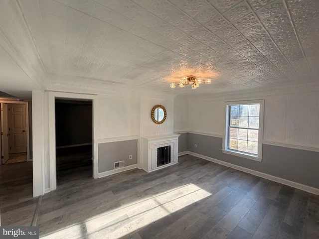 a view of staircase with wooden floor and windows