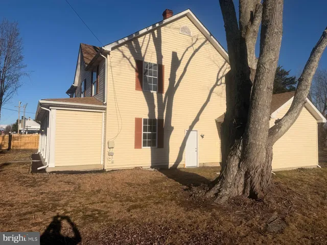 a view of a house with a tree
