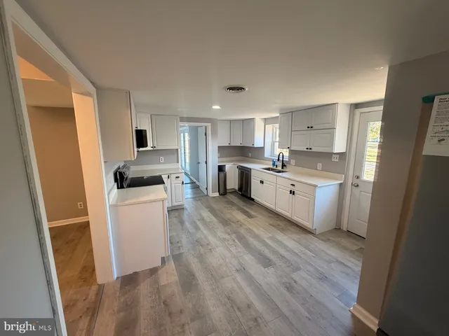 a white toilet sitting next to a bathroom sink
