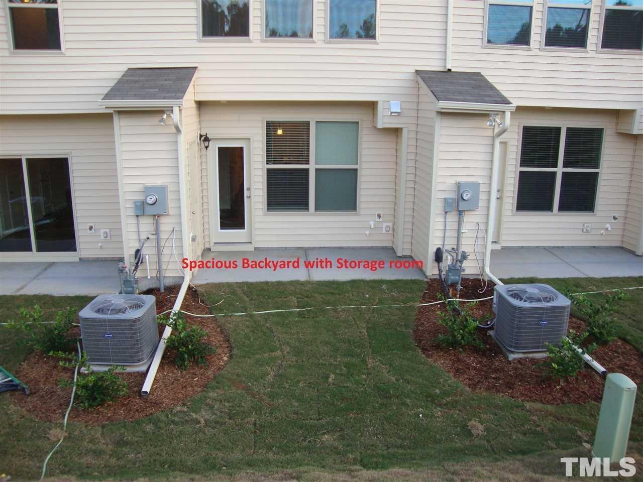 85 Intuition Circle Durham, NC 27705 - Photo 14 of 17 a view of a chair and table in backyard of the house