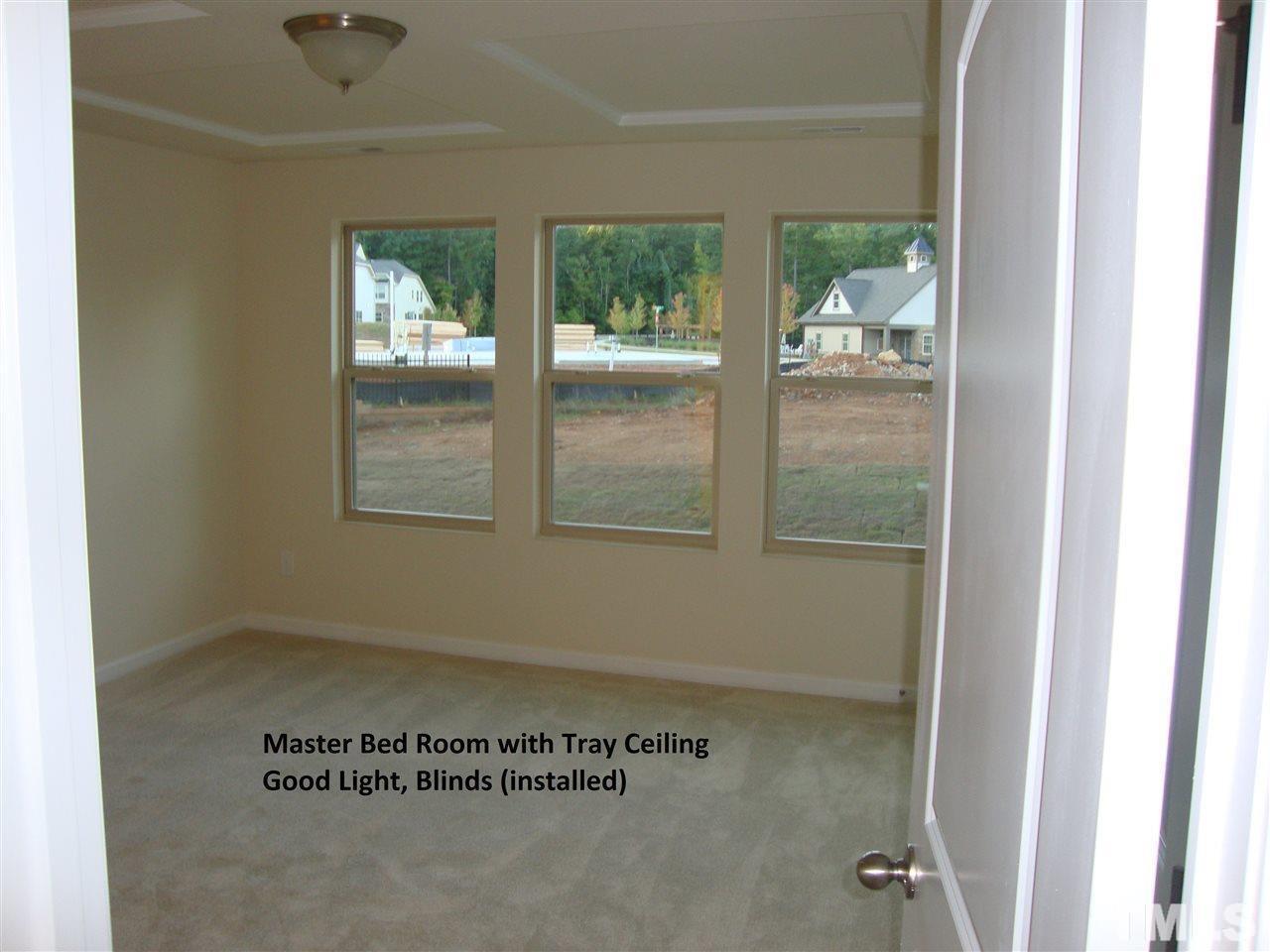 85 Intuition Circle Durham, NC 27705 - Photo 5 of 17 a view of a hallway with a window