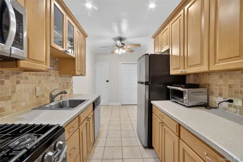 a kitchen that has a sink and a stove