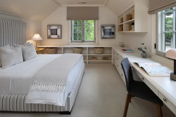 a bedroom with a bed and a night stand