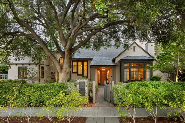 front view of a house with a tree