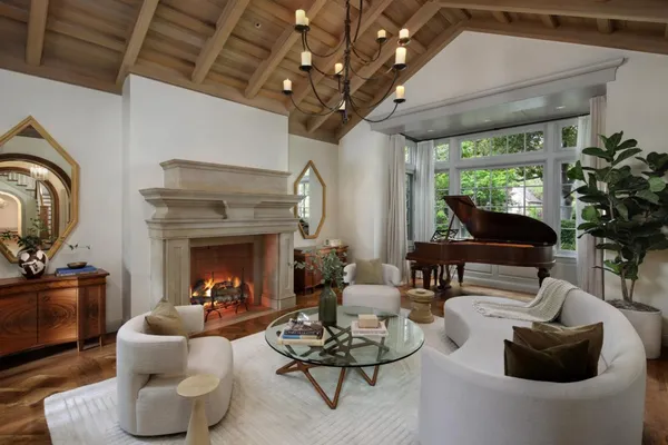 a living room with furniture and a fireplace