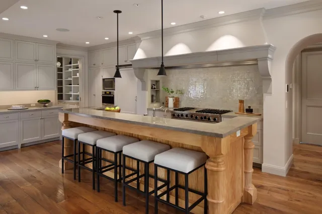 a kitchen with a table and chairs in it
