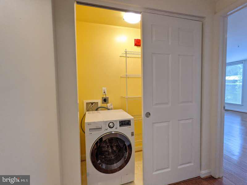 1911 Belmont Road Northwest, Unit 71 Washington, DC 20009 - Photo 13 of 22 Hall closet with W/D combo